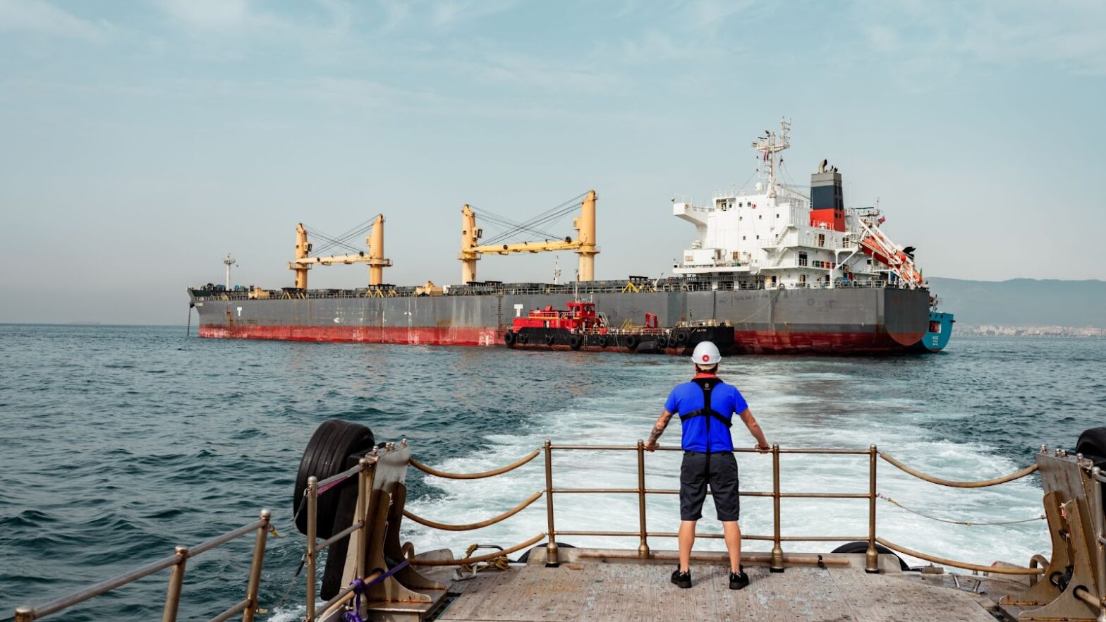 port agent looking out at sea